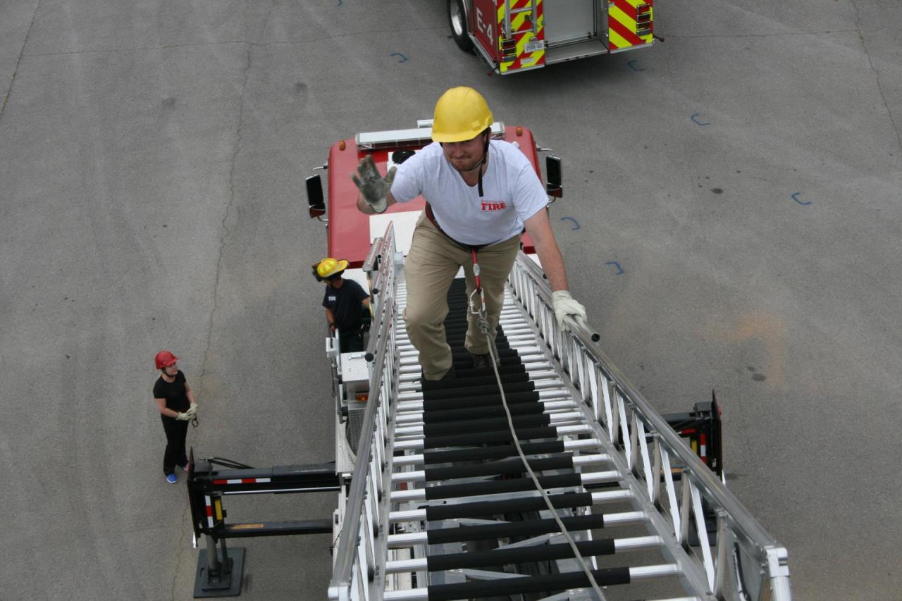 Photo of man climbing ladder