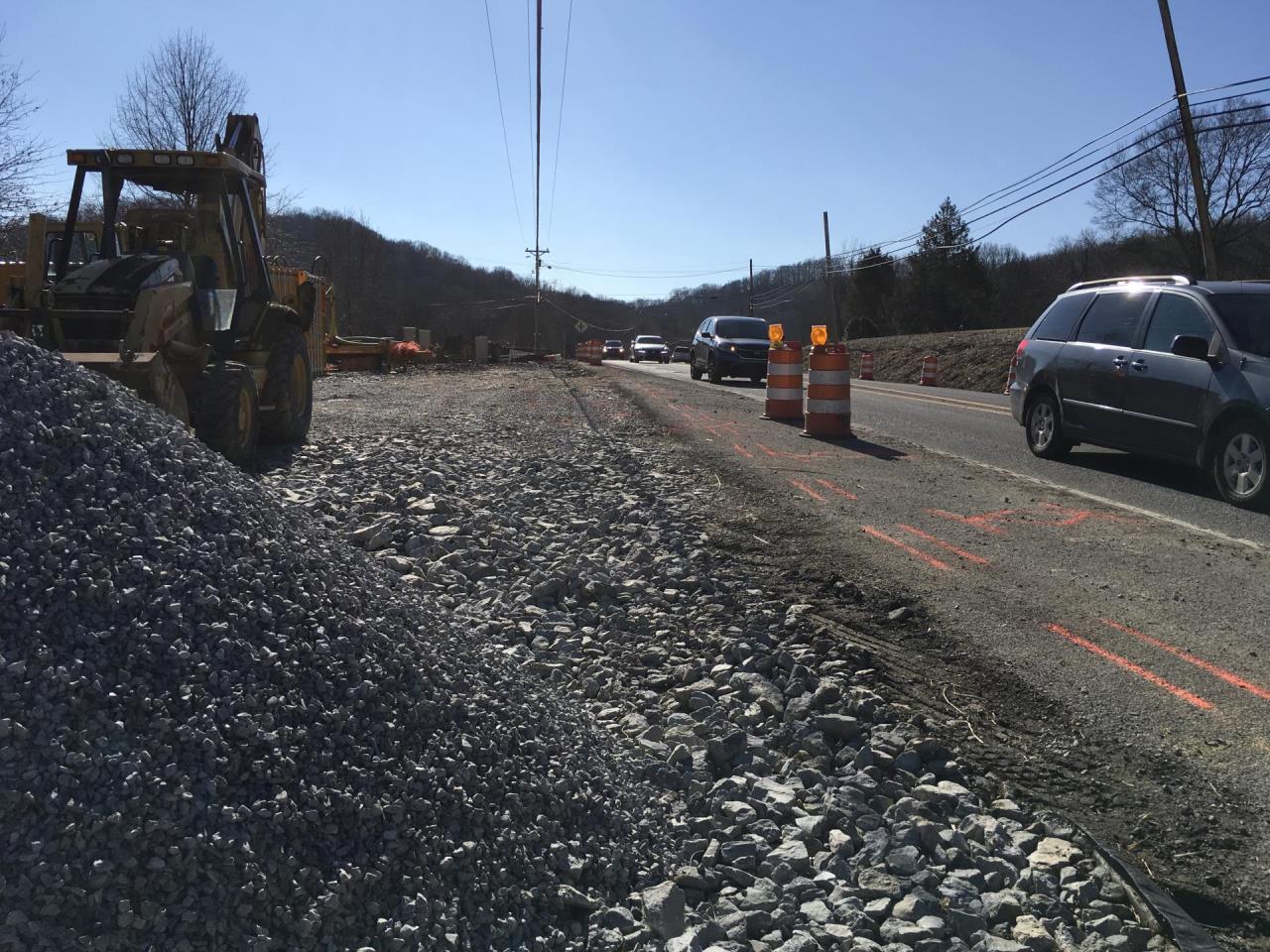 photo of a car driving in construction zone