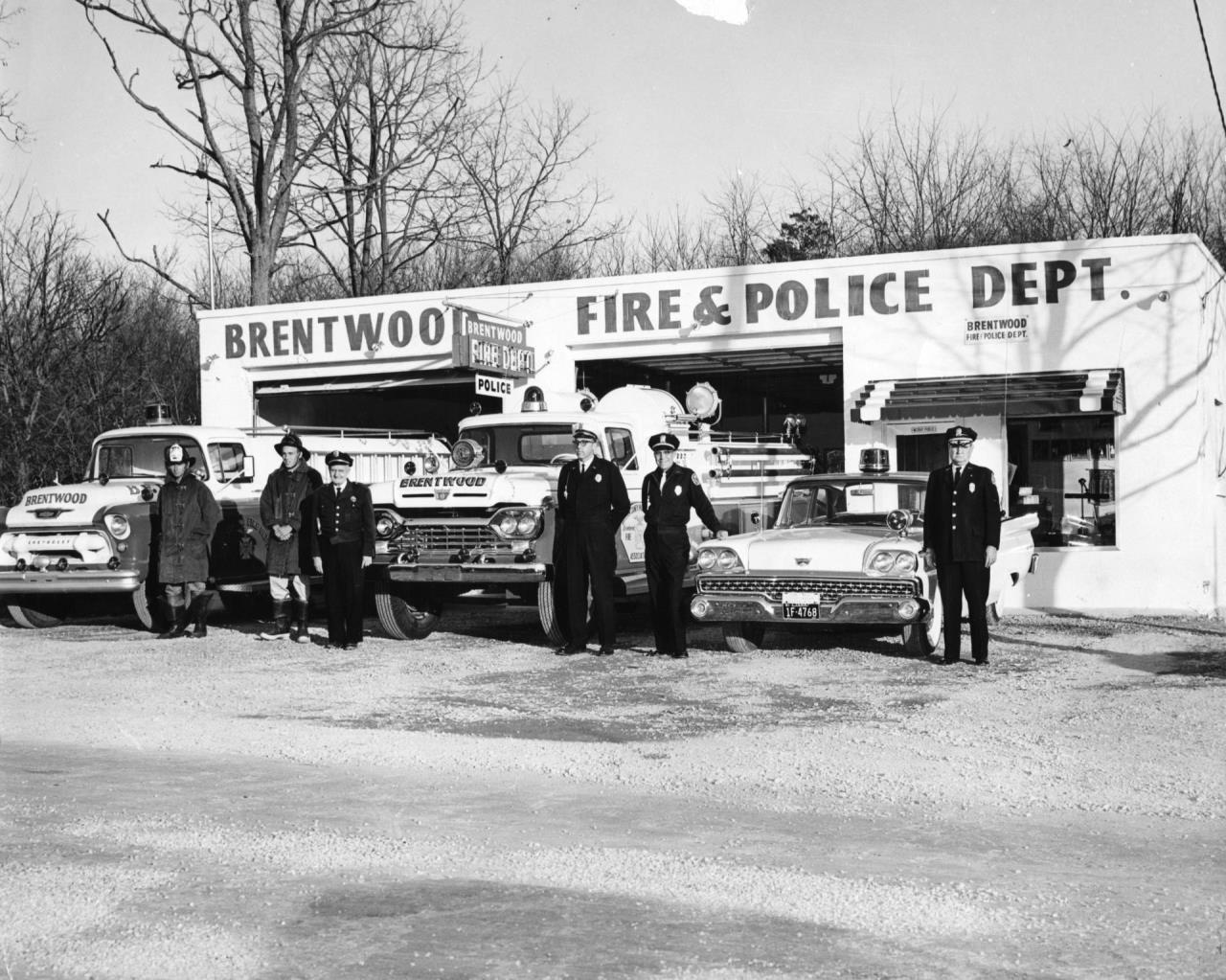 image of fire and police standing infront of old building