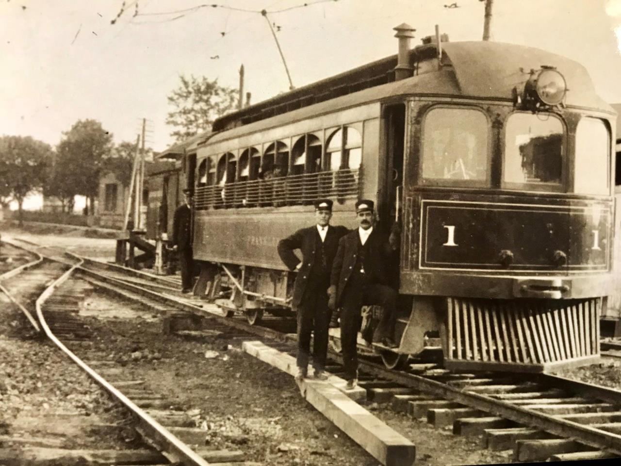 photo of old train and two men