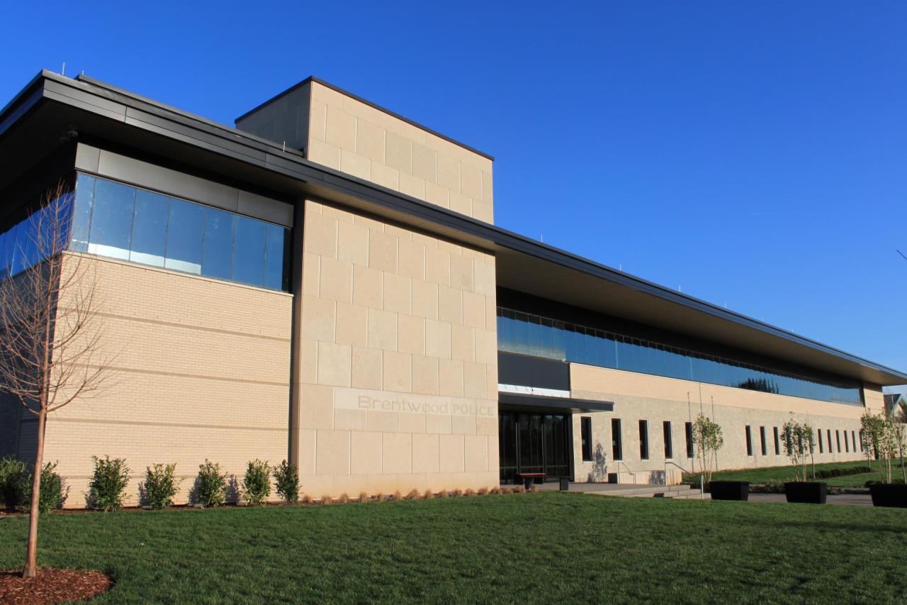 front of new building with blue sky