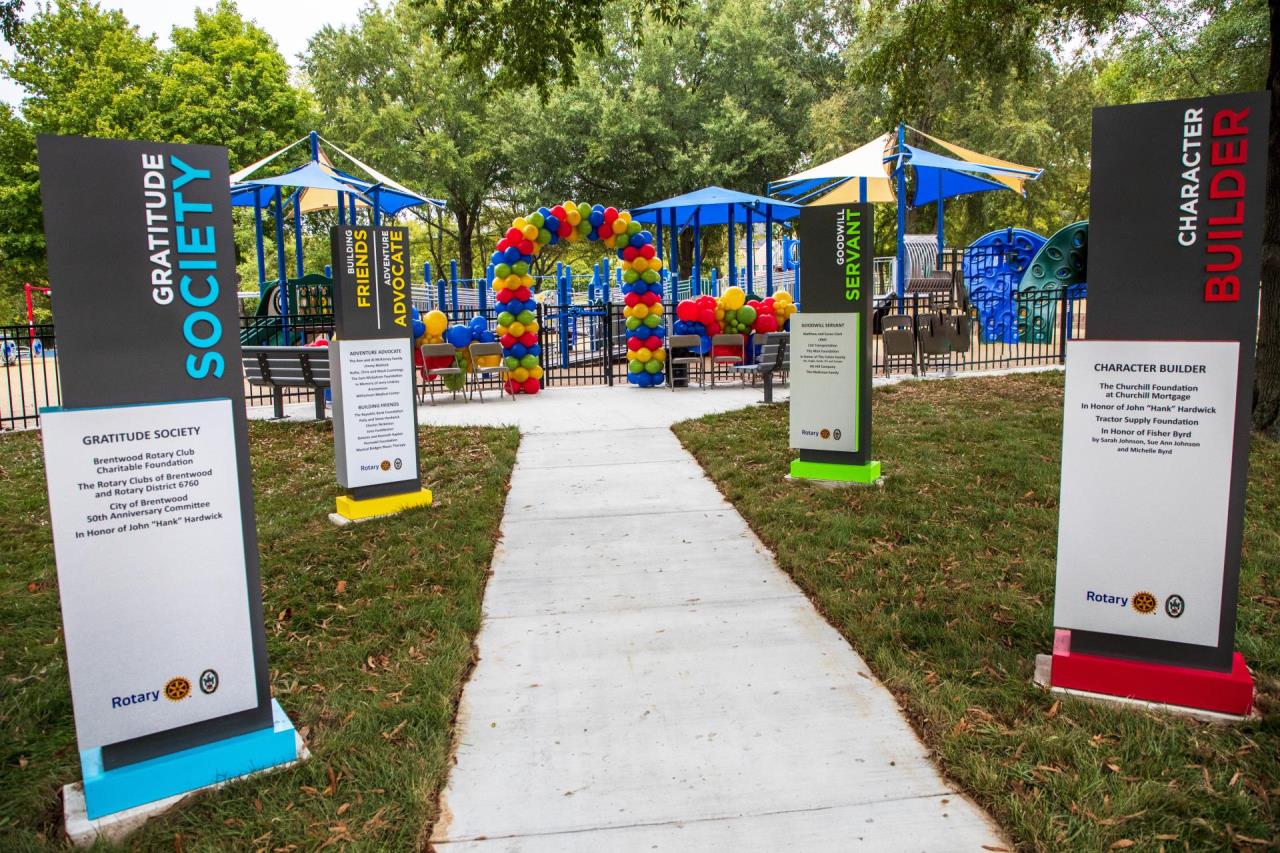 View of the entrance to the playground with the balloon arch at the grand opening.