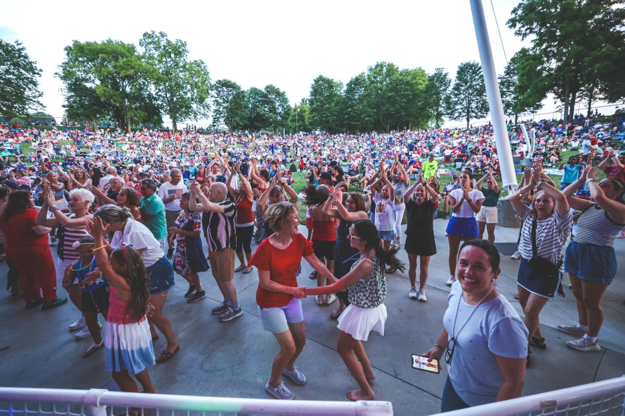 View from the stage looking out at the crowd dancing at a Red, White, and Boom celebration.